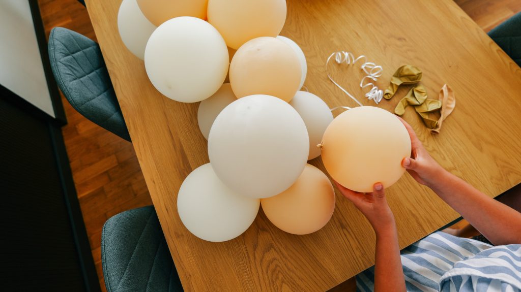 Assembling a festive balloon garland for a special celebration event